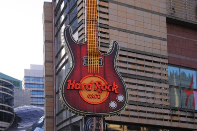 Photo of WARSAW, POLAND - MARCH 22, 2022: Hard Rock cafe on city street