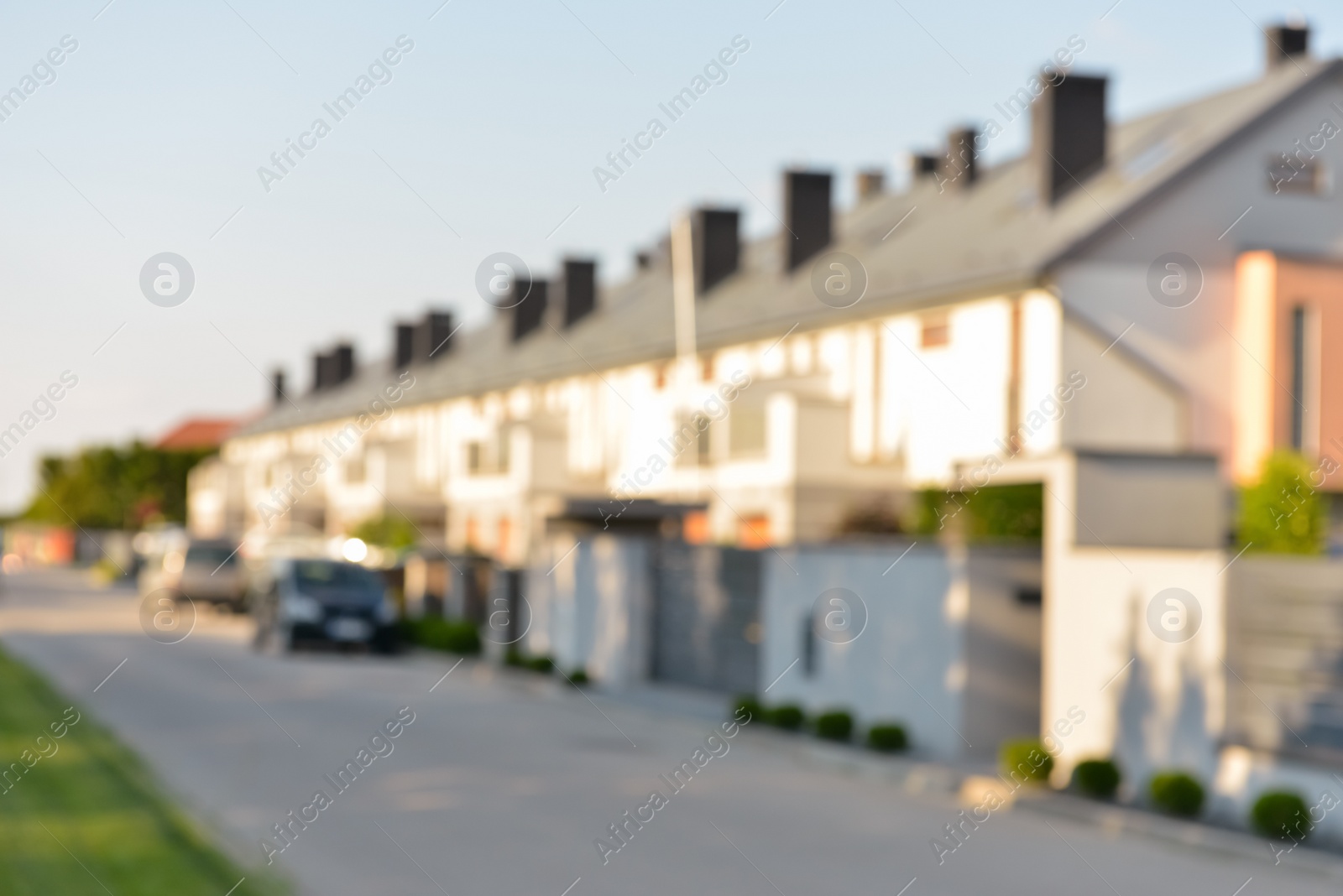 Photo of Blurred view of suburban street with beautiful houses