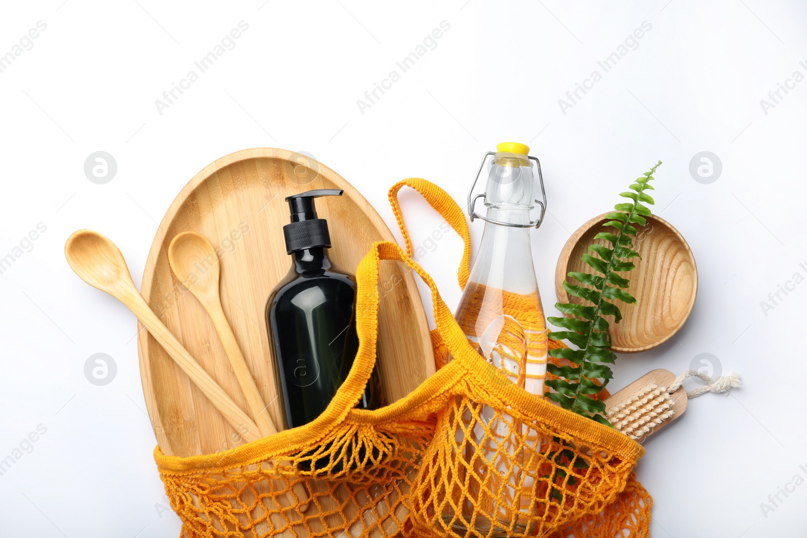 Photo of Bag with eco friendly products on white background, flat lay