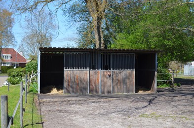 Photo of Horse stable at farm on sunny day