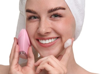 Photo of Washing face. Young woman with brush and cleansing foam on white background, closeup
