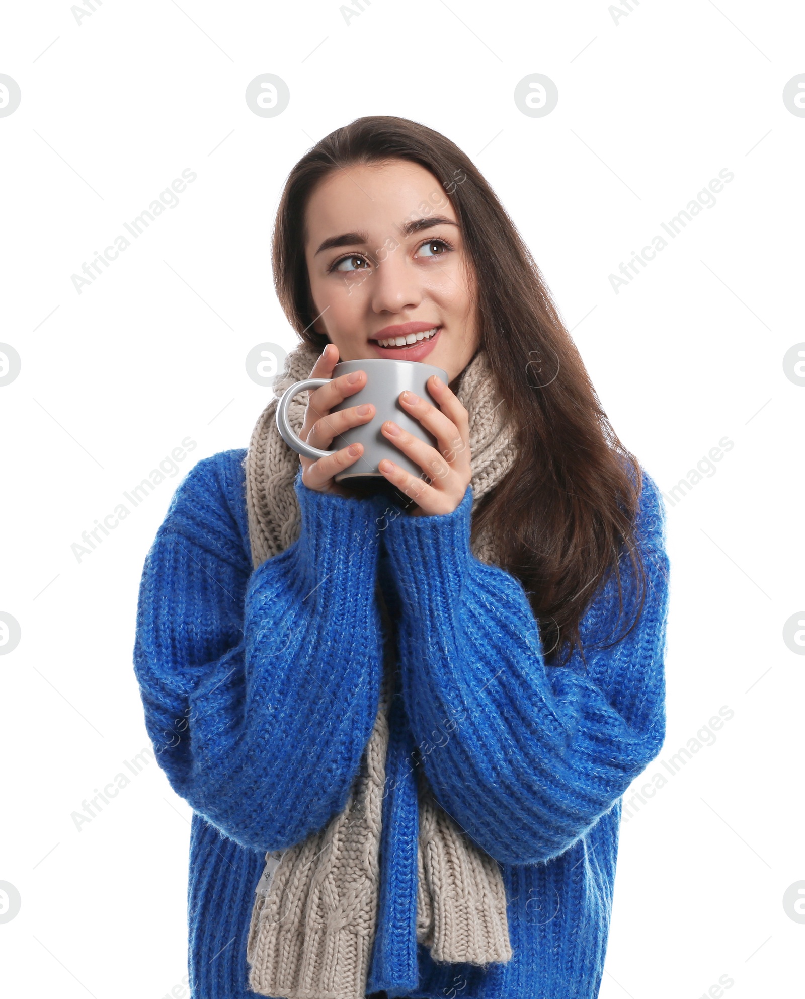 Photo of Young woman with cup of hot coffee on white background. Winter season