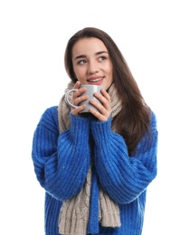 Young woman with cup of hot coffee on white background. Winter season