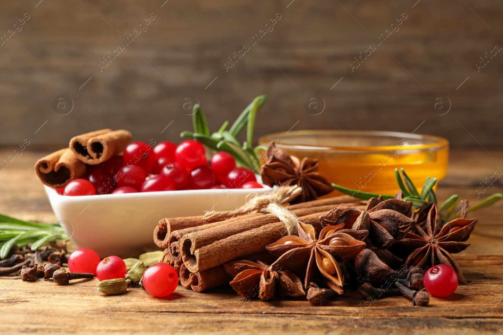 Photo of Composition with mulled wine ingredients on wooden table