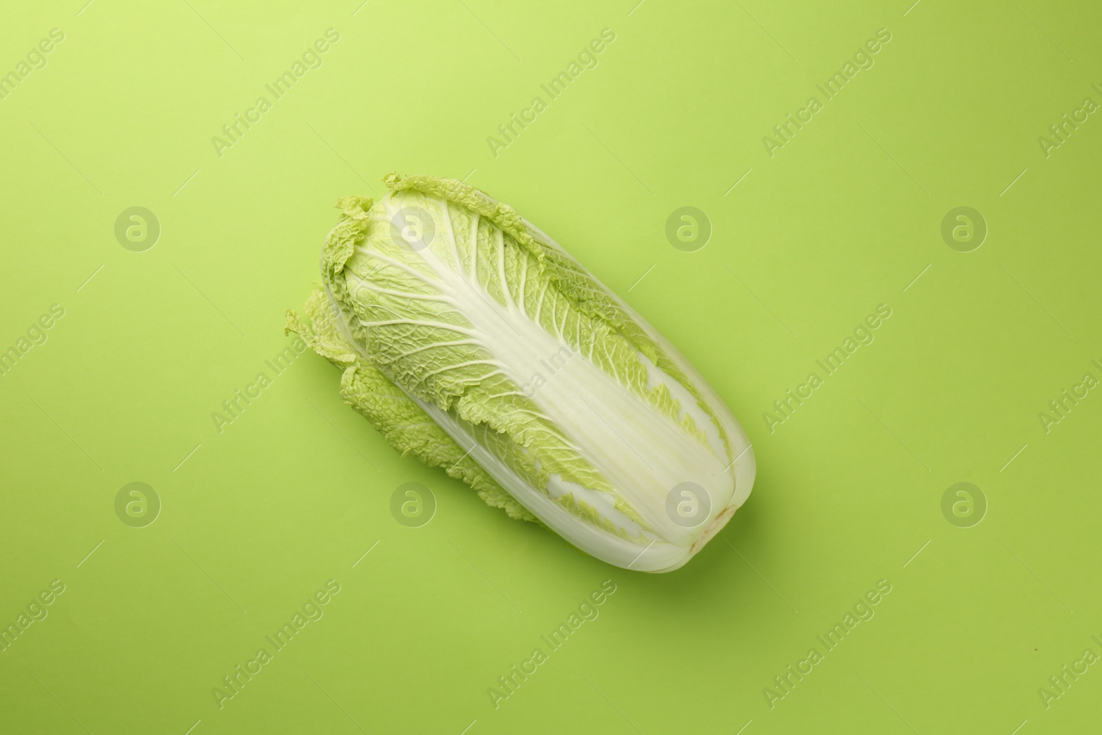 Photo of Fresh ripe Chinese cabbage on light green background, top view