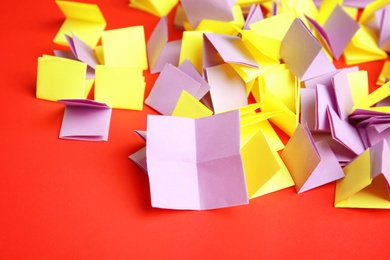 Pile of paper pieces for lottery on color background