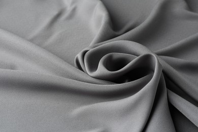 Photo of Texture of grey crumpled silk fabric as background, closeup