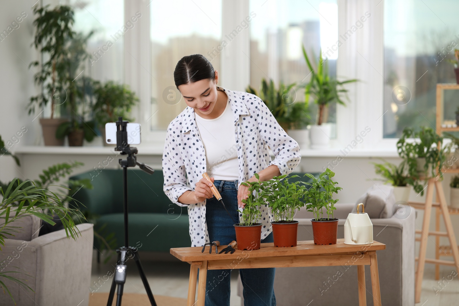 Photo of Teacher conducting online gardening course at home. Time for hobby