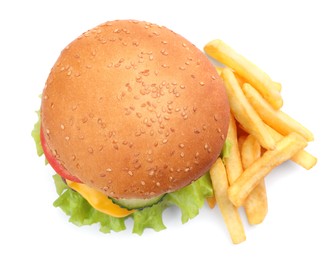 Photo of French fries and tasty burger on white background, top view