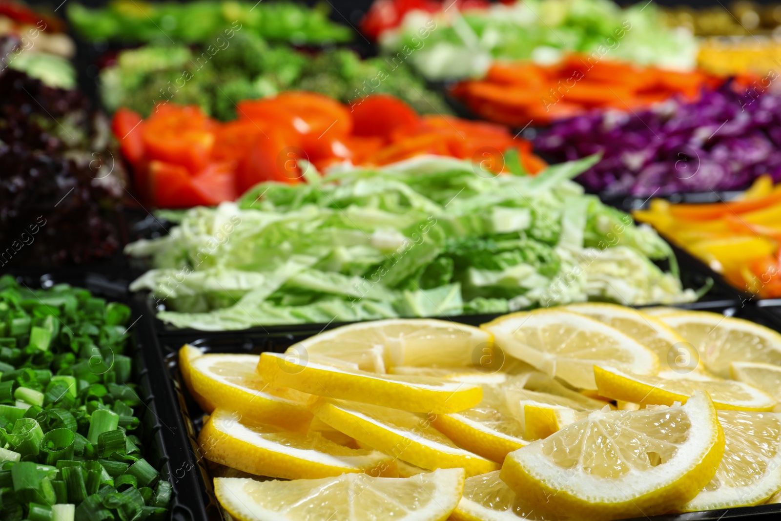 Photo of Salad bar with different fresh ingredients as background, closeup