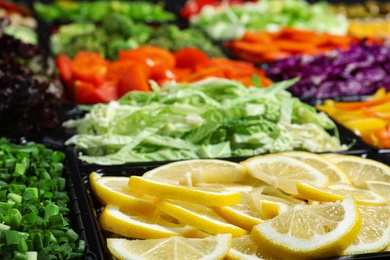 Salad bar with different fresh ingredients as background, closeup