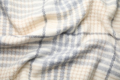 Photo of Soft crumpled checkered plaid as background, top view