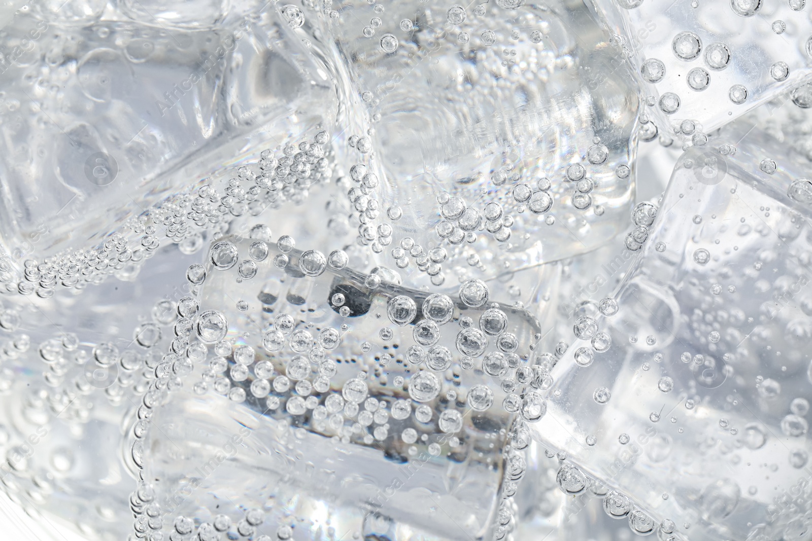 Photo of Soda water with ice as background, closeup