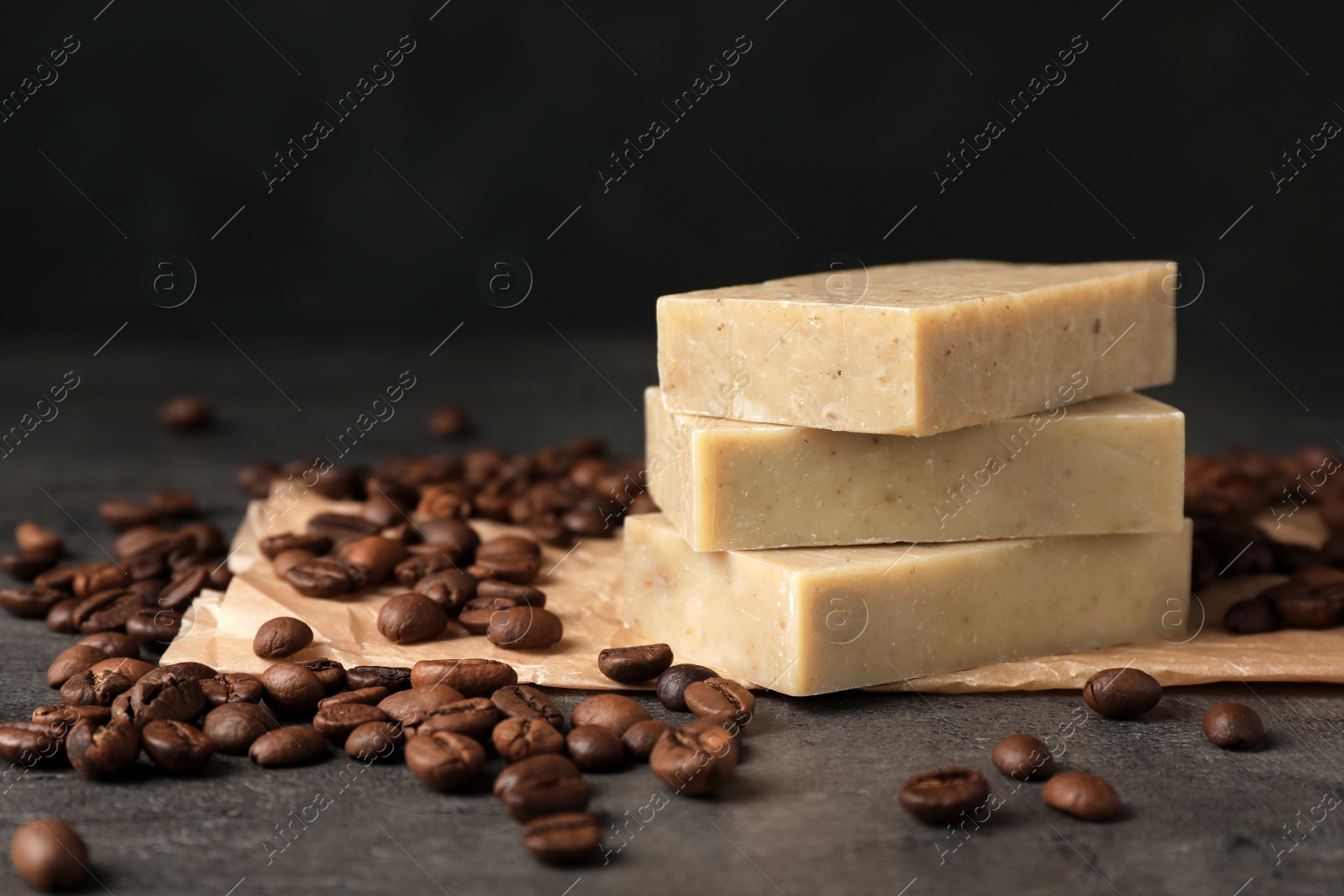 Photo of Handmade soap bars and coffee beans on table