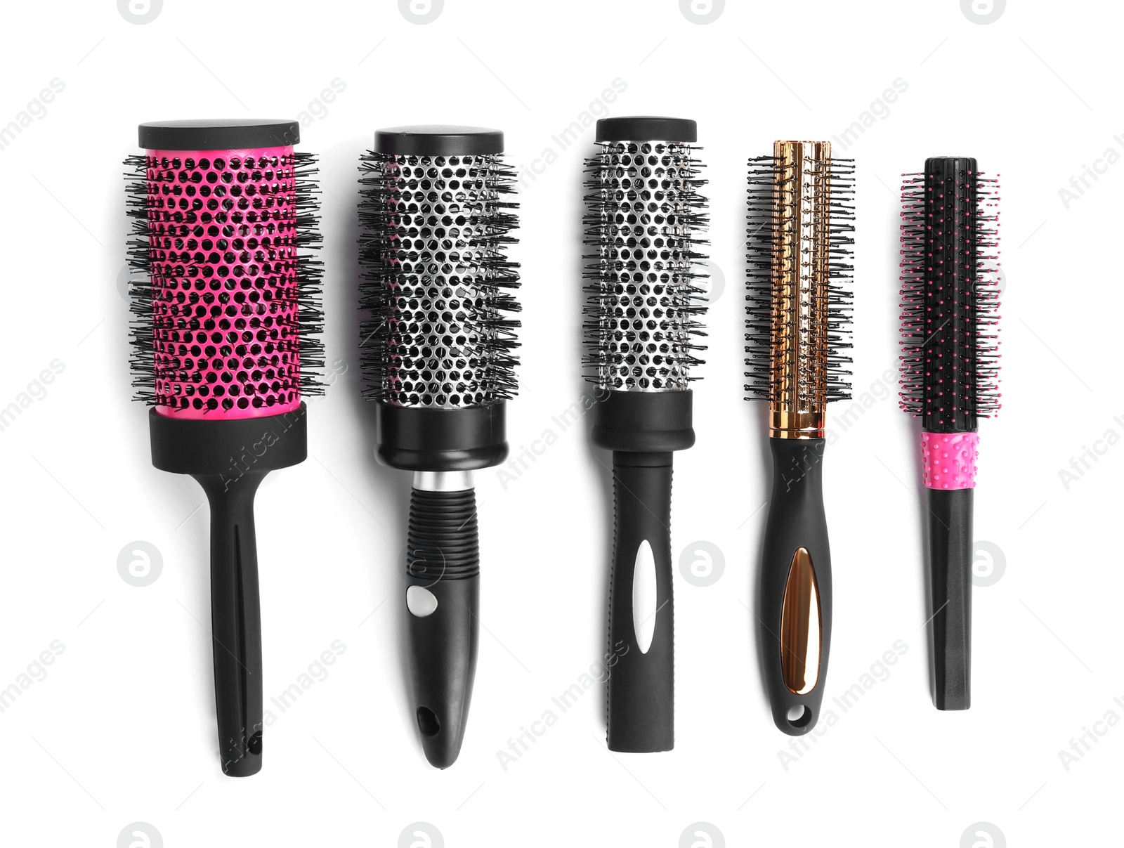 Photo of Set of round hair brushes isolated on white, top view