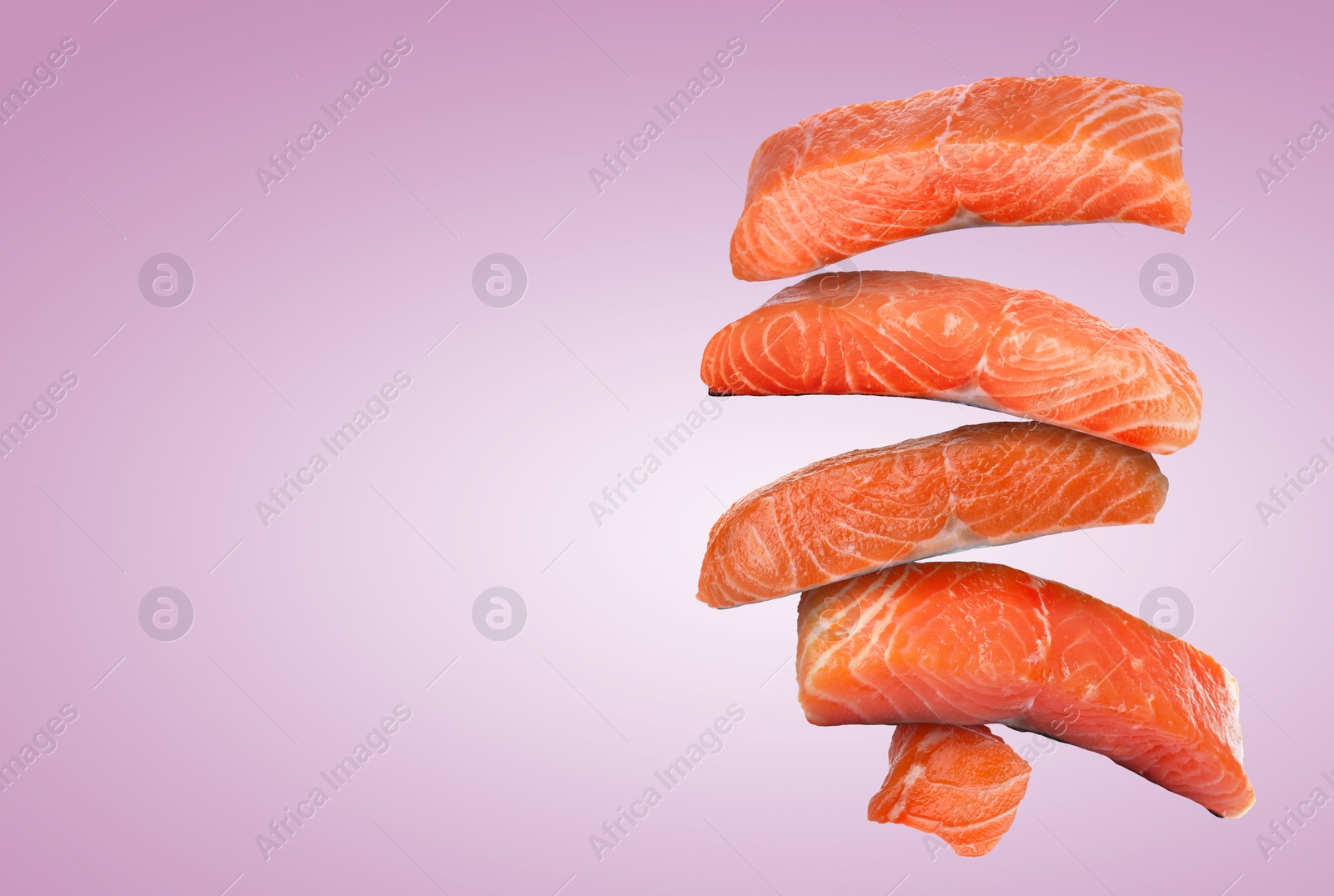 Image of Cut fresh salmon falling on violet gradient background, space for text