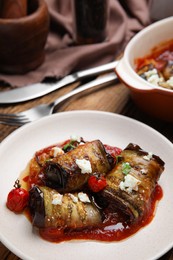 Tasty eggplant rolls served on table, closeup