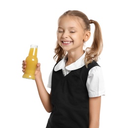Photo of Happy girl holding bottle of juice on white background