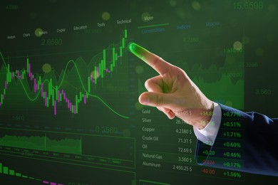 Stock exchange. Businessman pointing at virtual screen electronic online trading platform, closeup