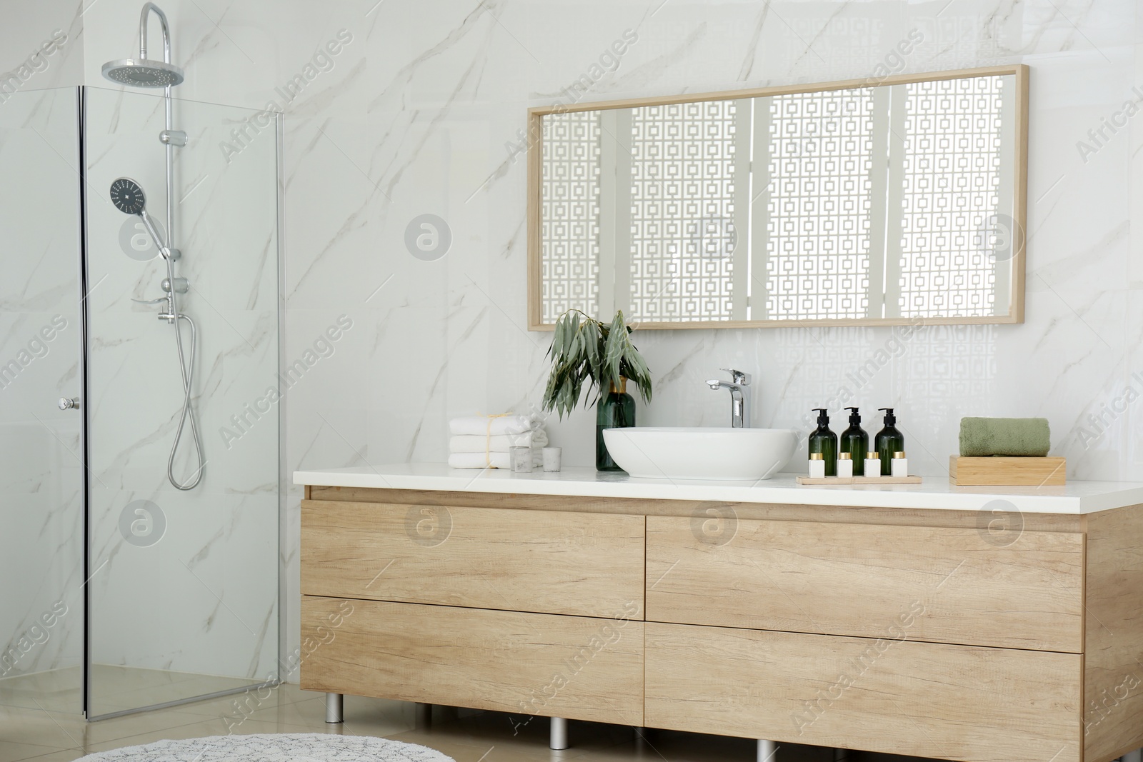 Photo of Modern bathroom interior with stylish mirror and vessel sink