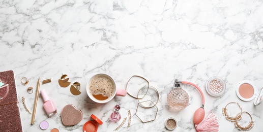 Flat lay composition with stylish female accessories and decorative cosmetics on marble background, space for text