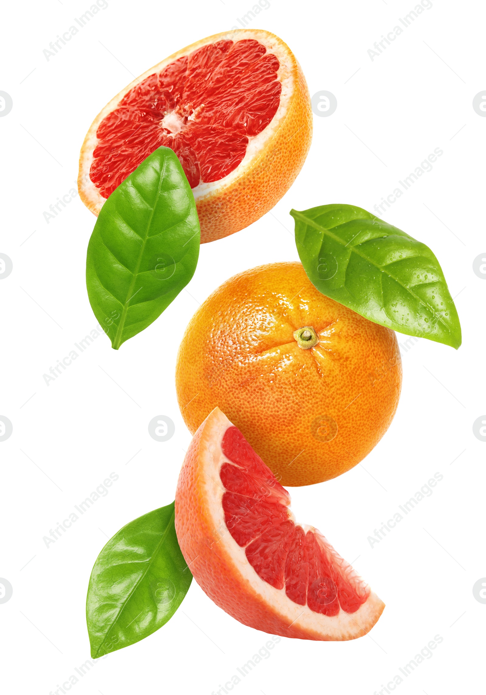 Image of Tasty ripe grapefruits and green leaves falling on white background