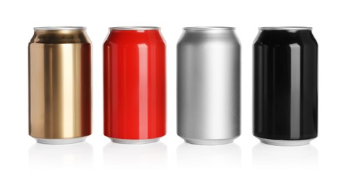 Photo of Set of aluminum cans with drinks on white background