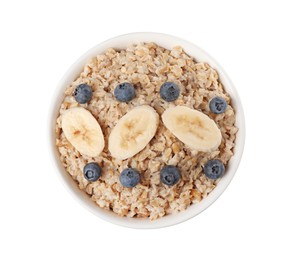 Tasty boiled oatmeal with blueberries and banana in bowl isolated on white, top view