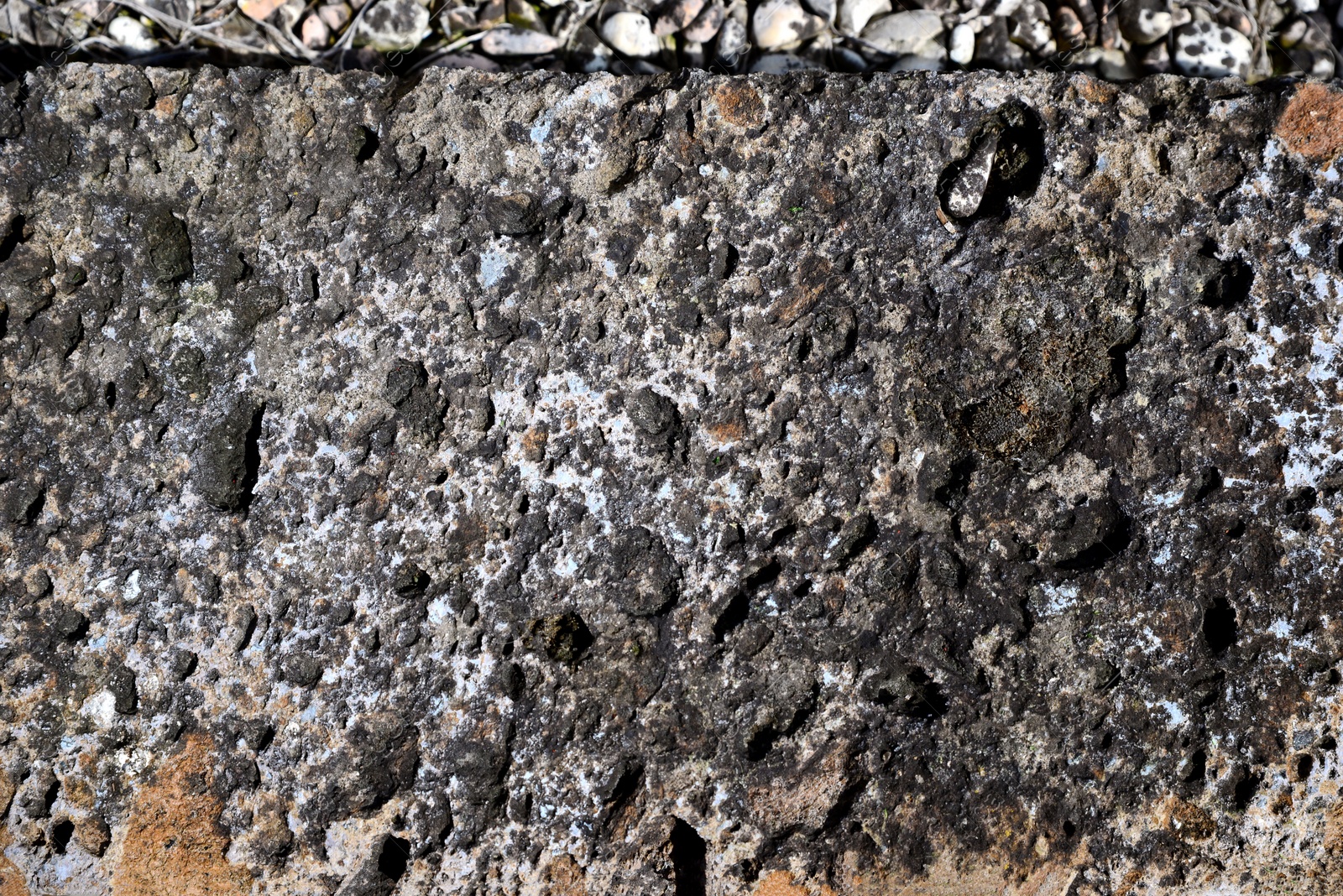 Photo of Texture of stone surface as background, top view