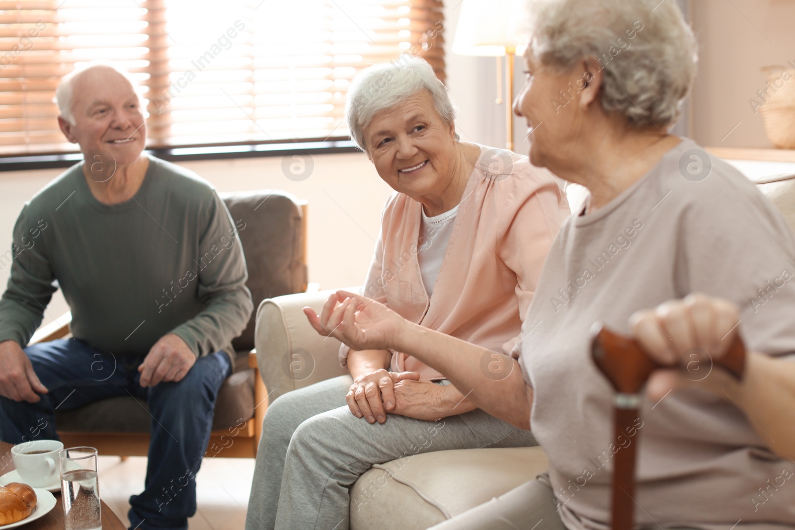 Photo of Elderly people spending time in geriatric hospice. Senior patients care