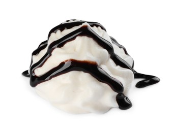Photo of Delicious fresh whipped cream with chocolate syrup isolated on white