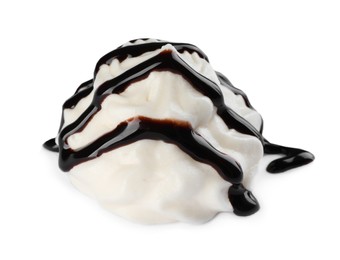 Delicious fresh whipped cream with chocolate syrup isolated on white