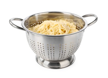Photo of Cooked spaghetti in metal colander isolated on white