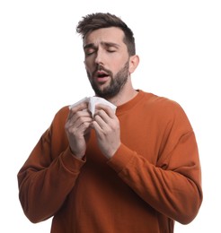 Photo of Sick man sneezing on white background. Cold symptoms