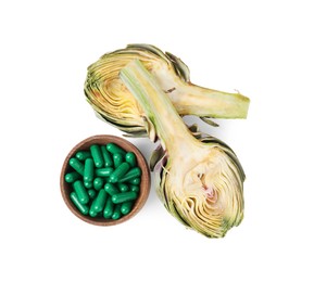 Fresh artichoke and pills isolated on white, top view