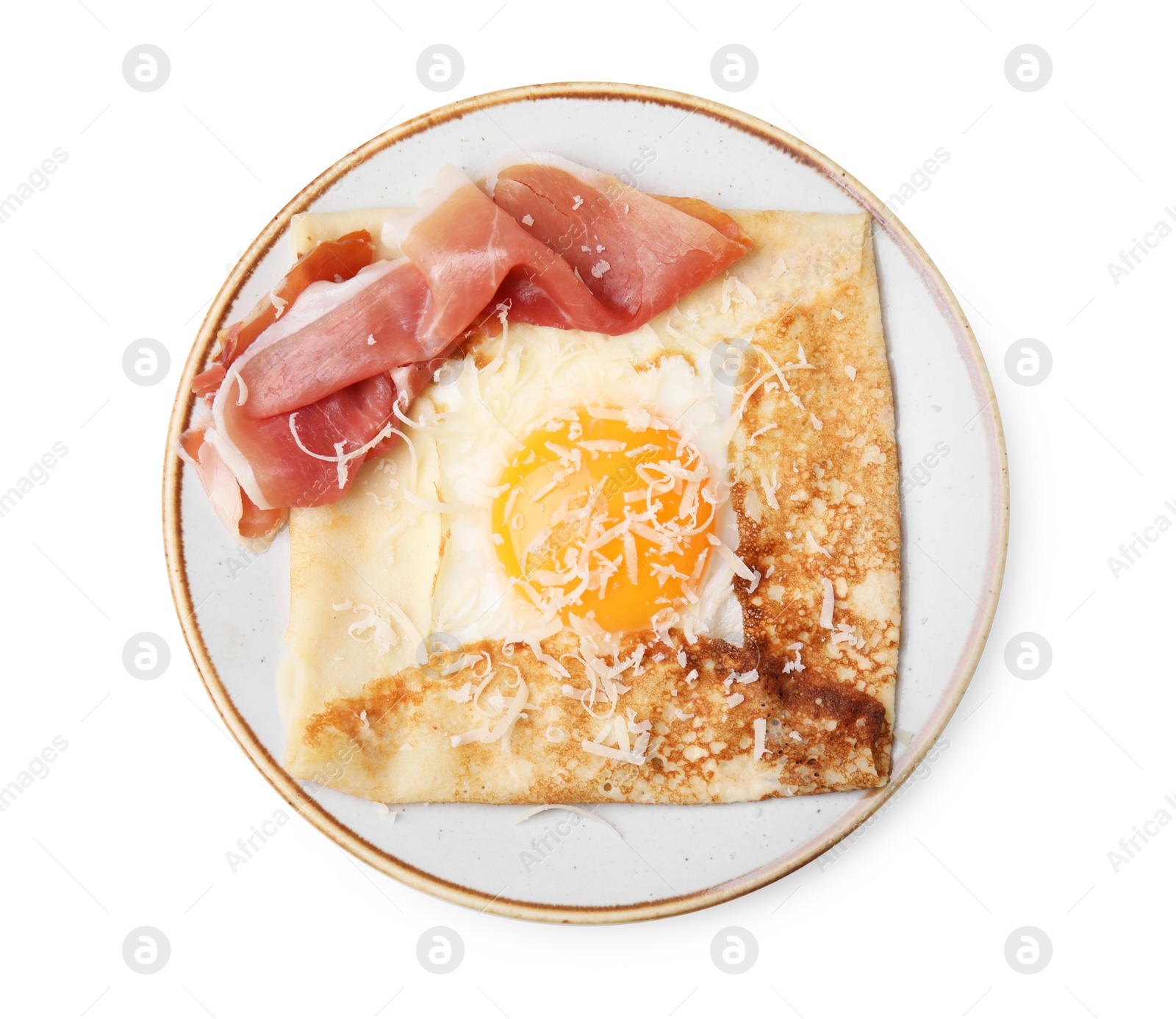 Photo of Delicious crepe with egg isolated on white, top view. Breton galette