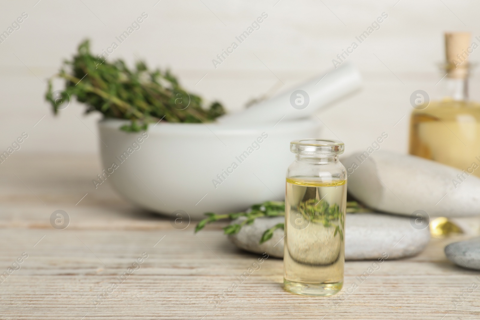 Photo of Composition with herbal essential oil on table. Space for text