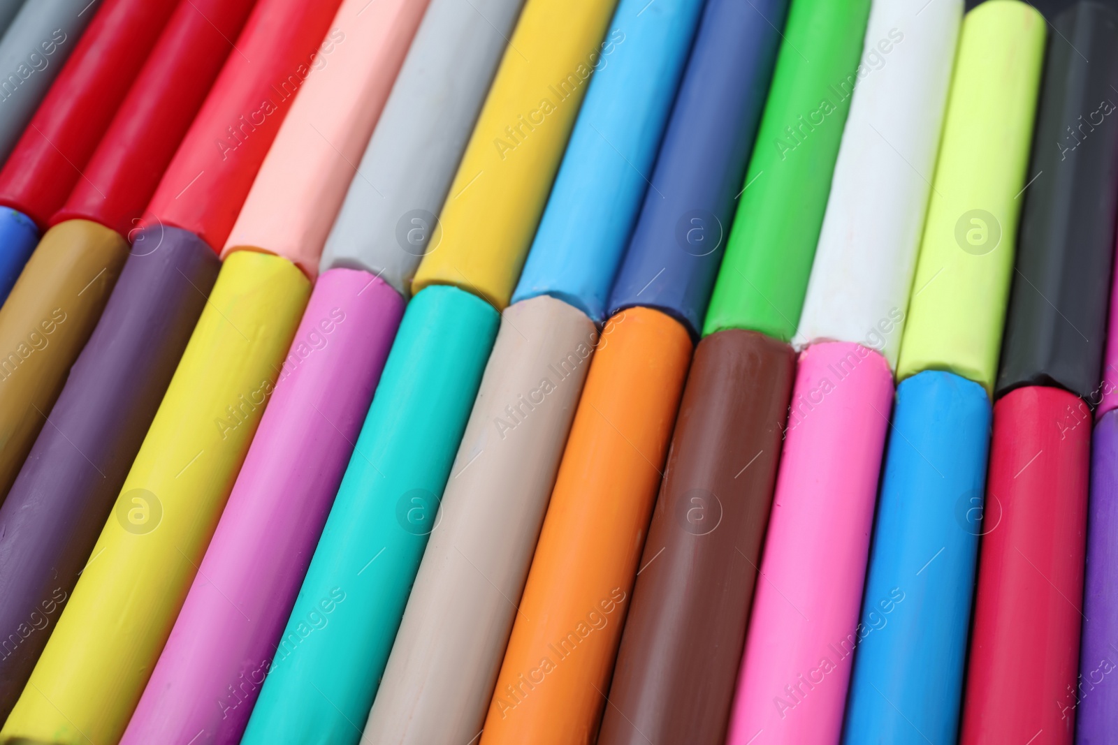 Photo of Many different colorful plasticine pieces as background, closeup