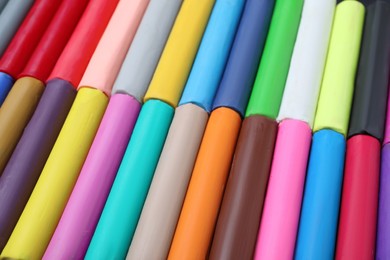 Many different colorful plasticine pieces as background, closeup