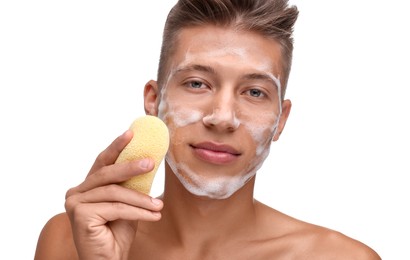 Photo of Young man washing his face with sponge on white background