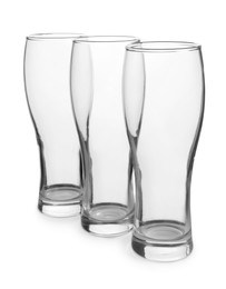 Photo of Elegant clean empty beer glasses isolated on white