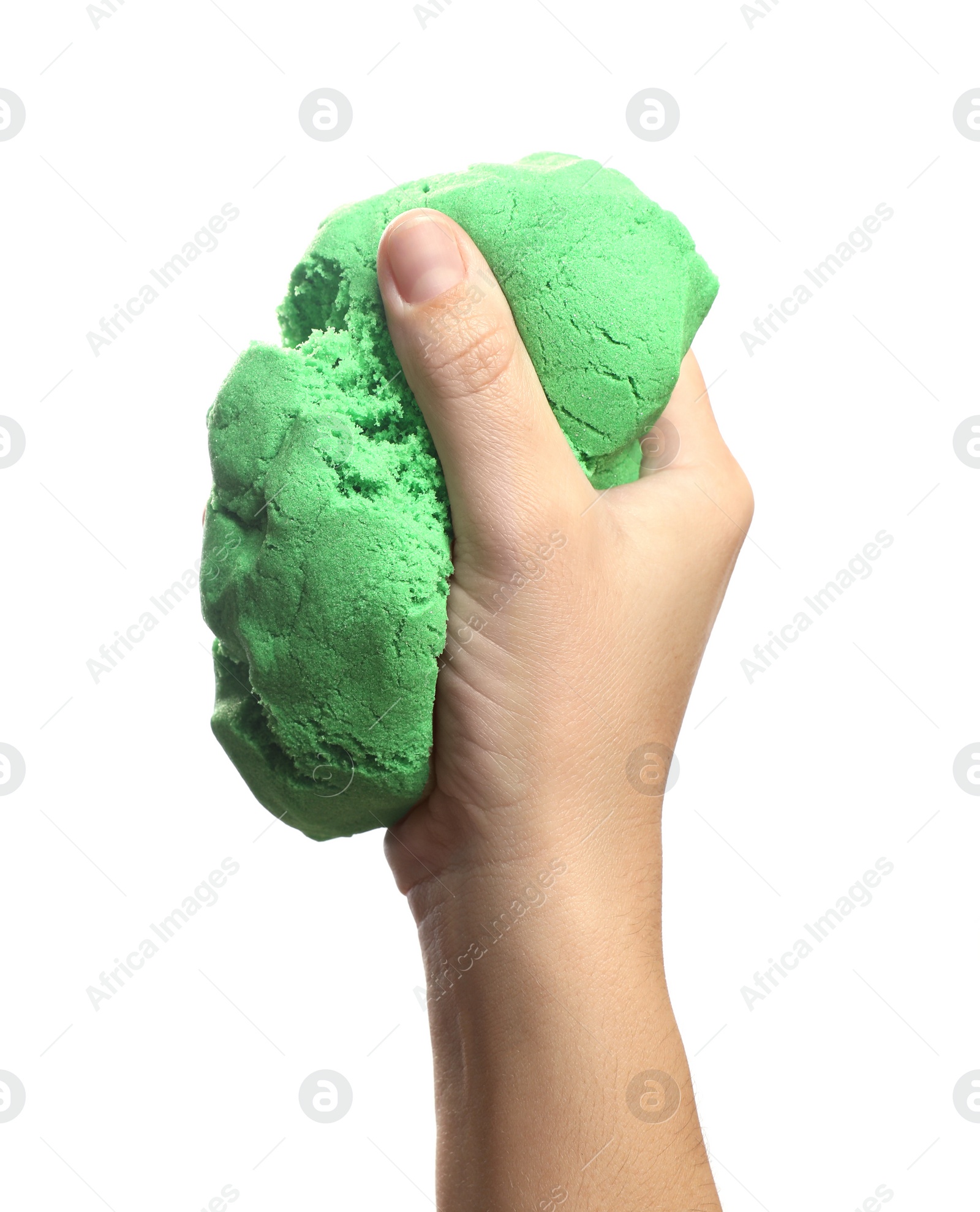 Photo of Woman playing with green kinetic sand on white background, closeup