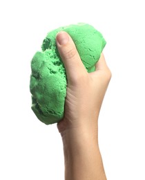 Photo of Woman playing with green kinetic sand on white background, closeup