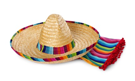 Photo of Mexican sombrero hat and colorful poncho isolated on white
