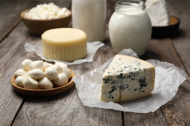 Different fresh dairy products on wooden table