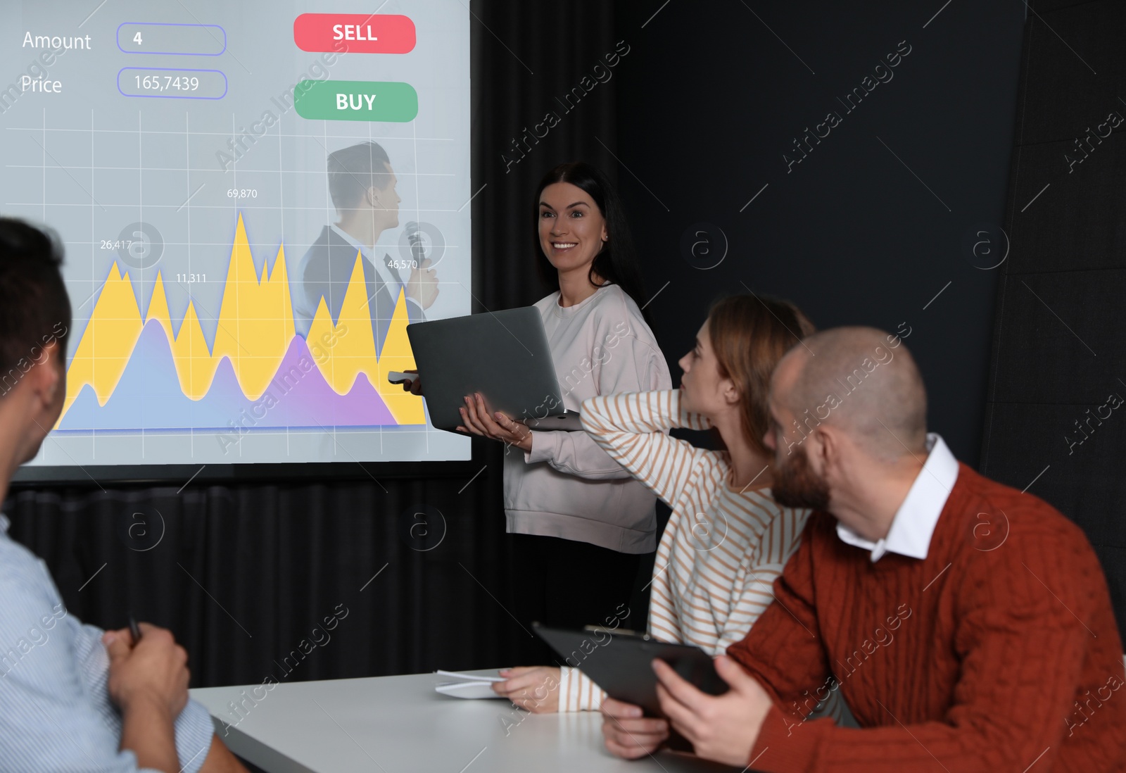 Image of Business people having meeting in office and financial charts on projection screen. Forex conference  