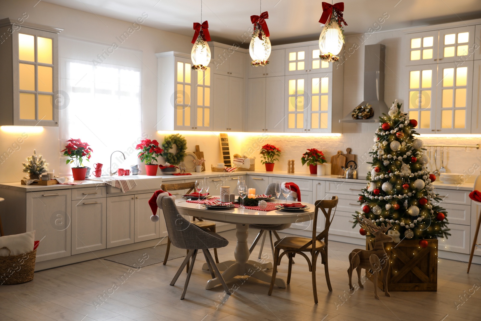 Photo of Stylish kitchen interior with beautiful Christmas decor