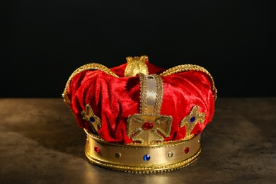 Beautiful velvet crown on grey table. Fantasy item