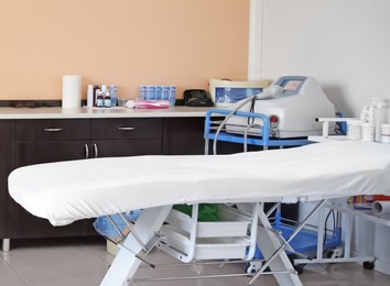 Office with massage table and equipment. Professional epilation