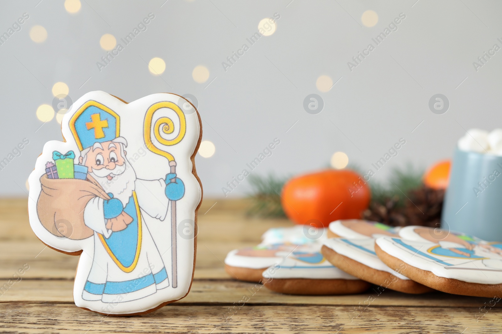 Photo of Delicious gingerbread cookies on wooden table. St. Nicholas Day celebration